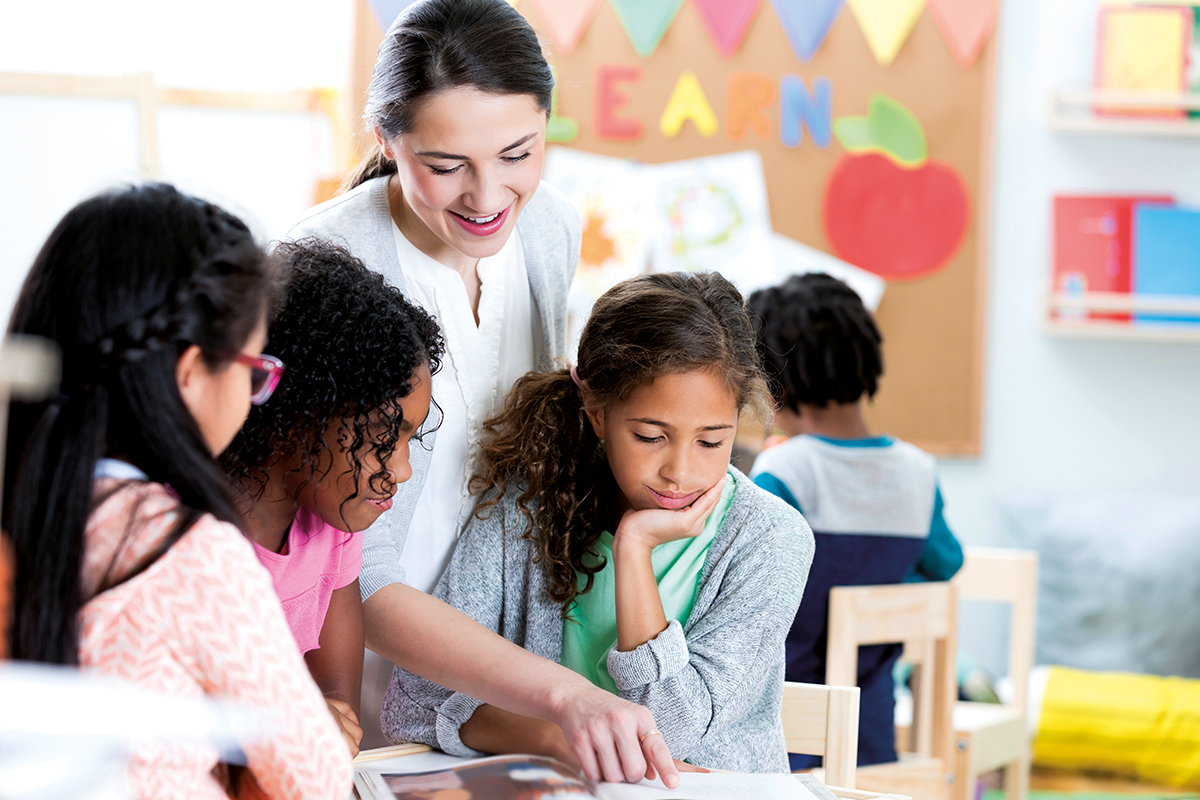 A teaching assistant at work in a classroom