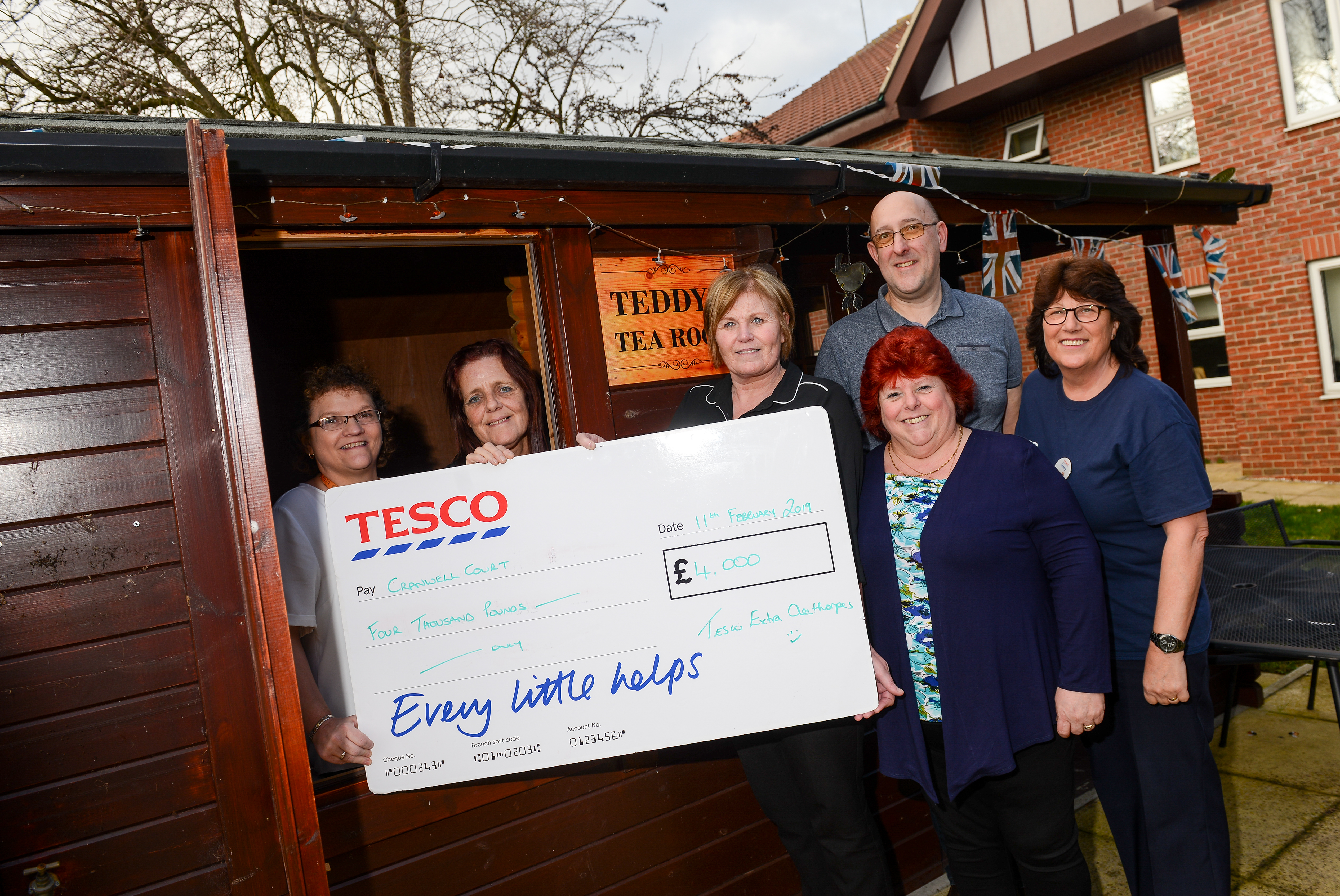 Cranwell Court staff receive their donation from Tesco