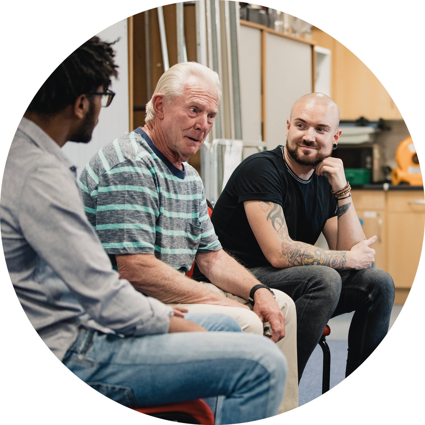 A diverse group of men talking as a group