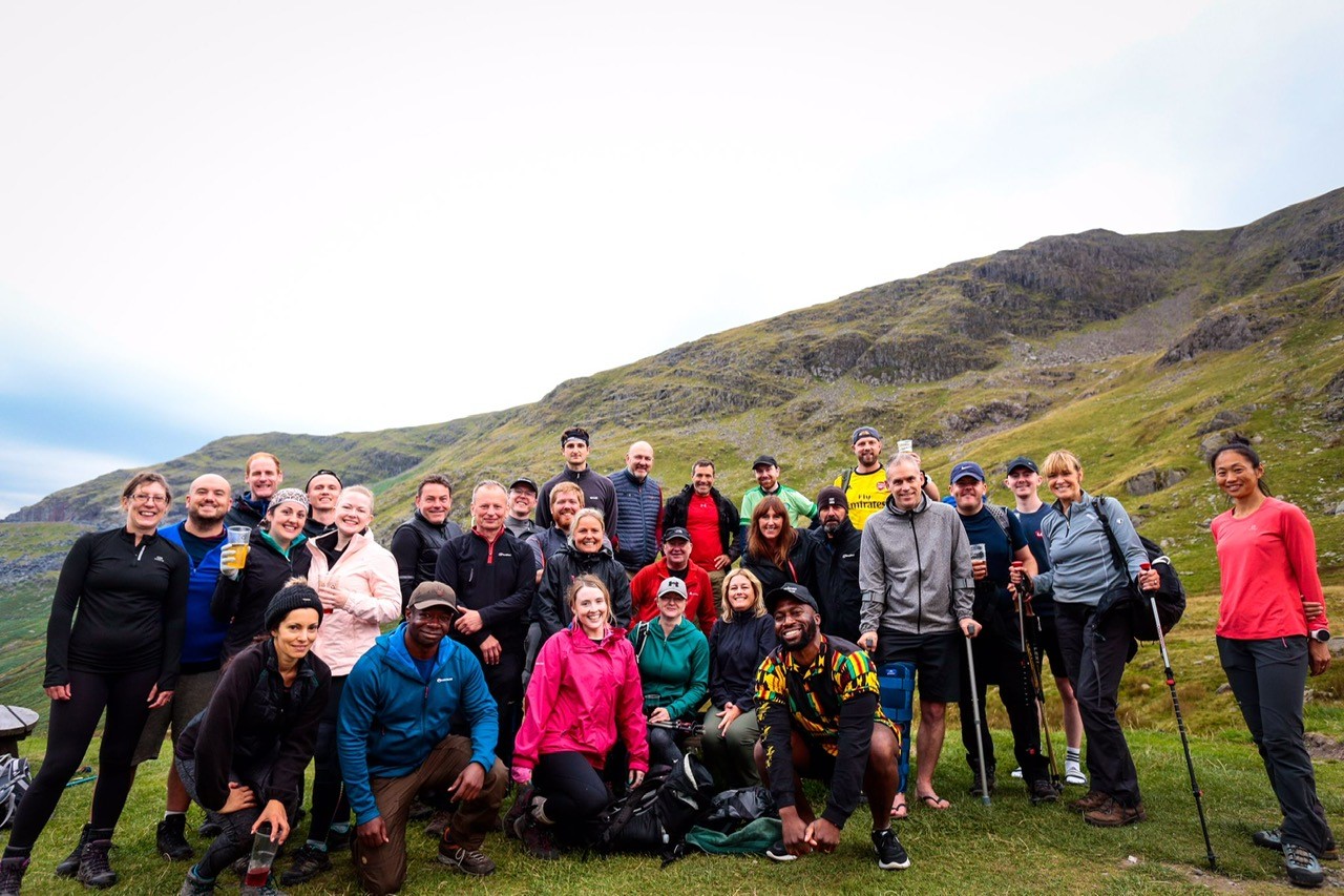 Group of people on top of a mountain