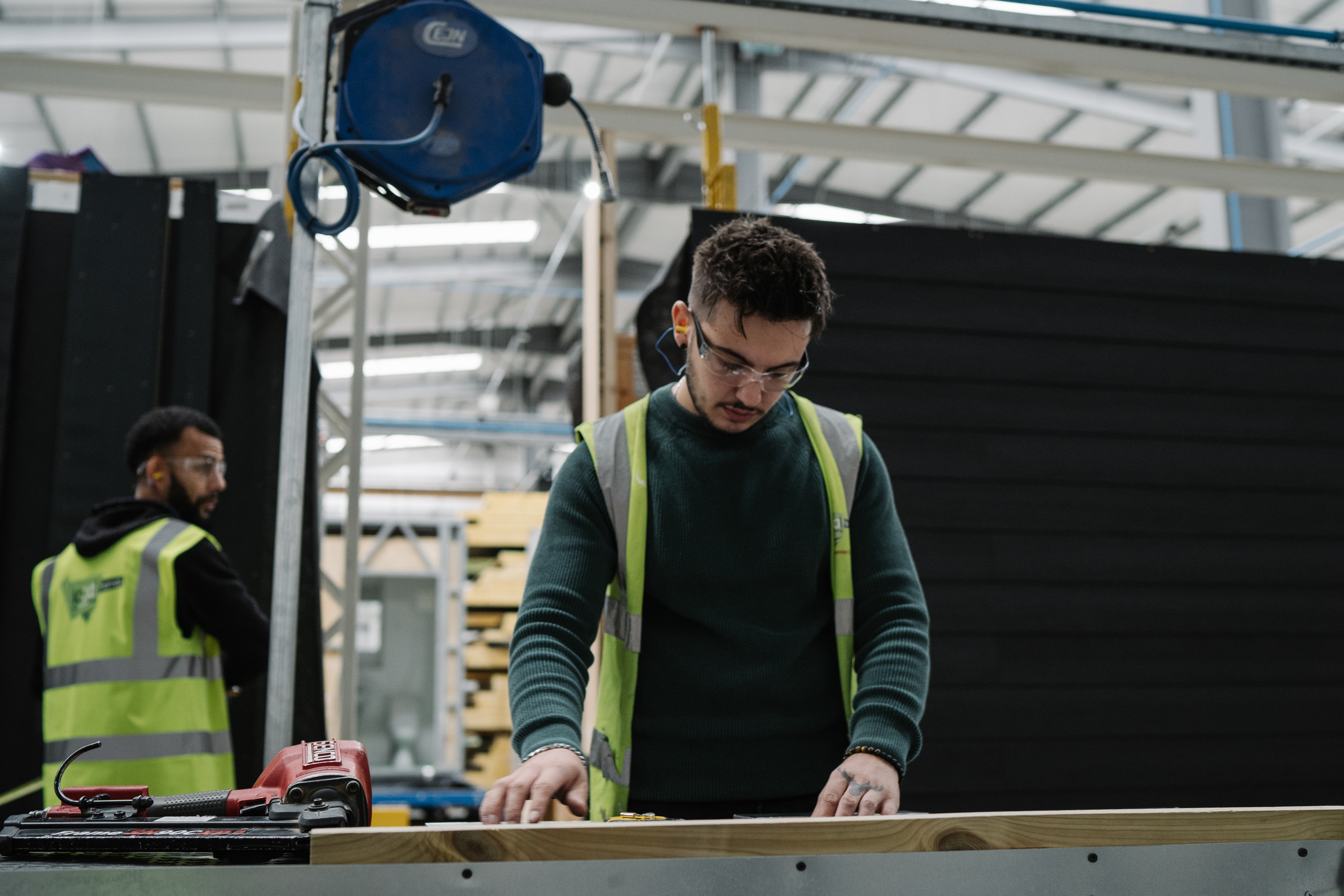 Person in high vis working in the LoCal homes factory