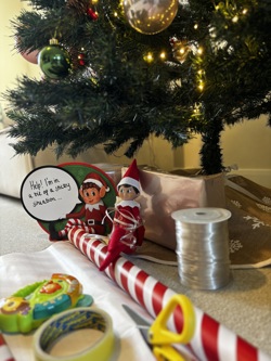 Elf with wrapping paper