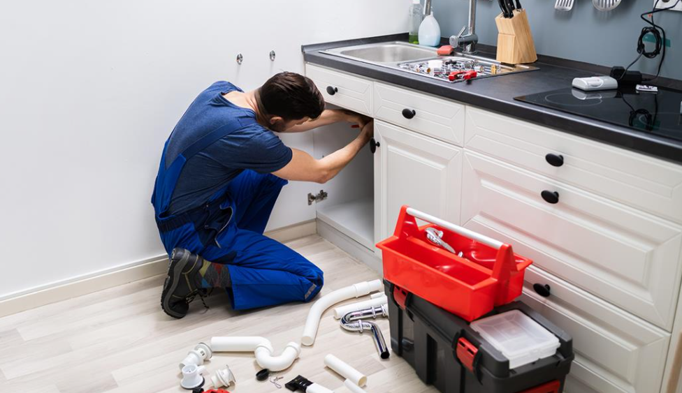 Man with a toolbox fix a repair