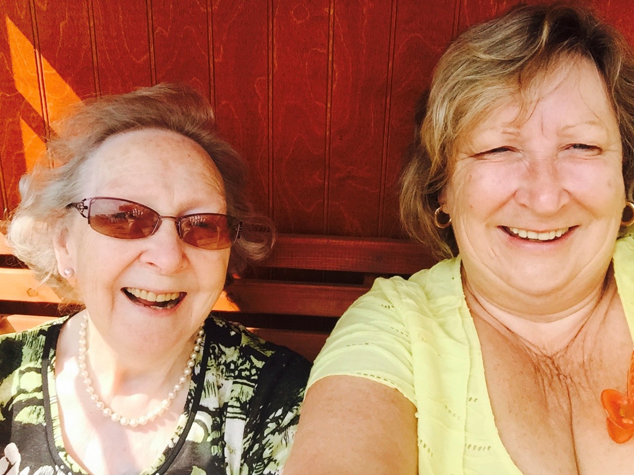 Two smiling ladies - mother and daughter