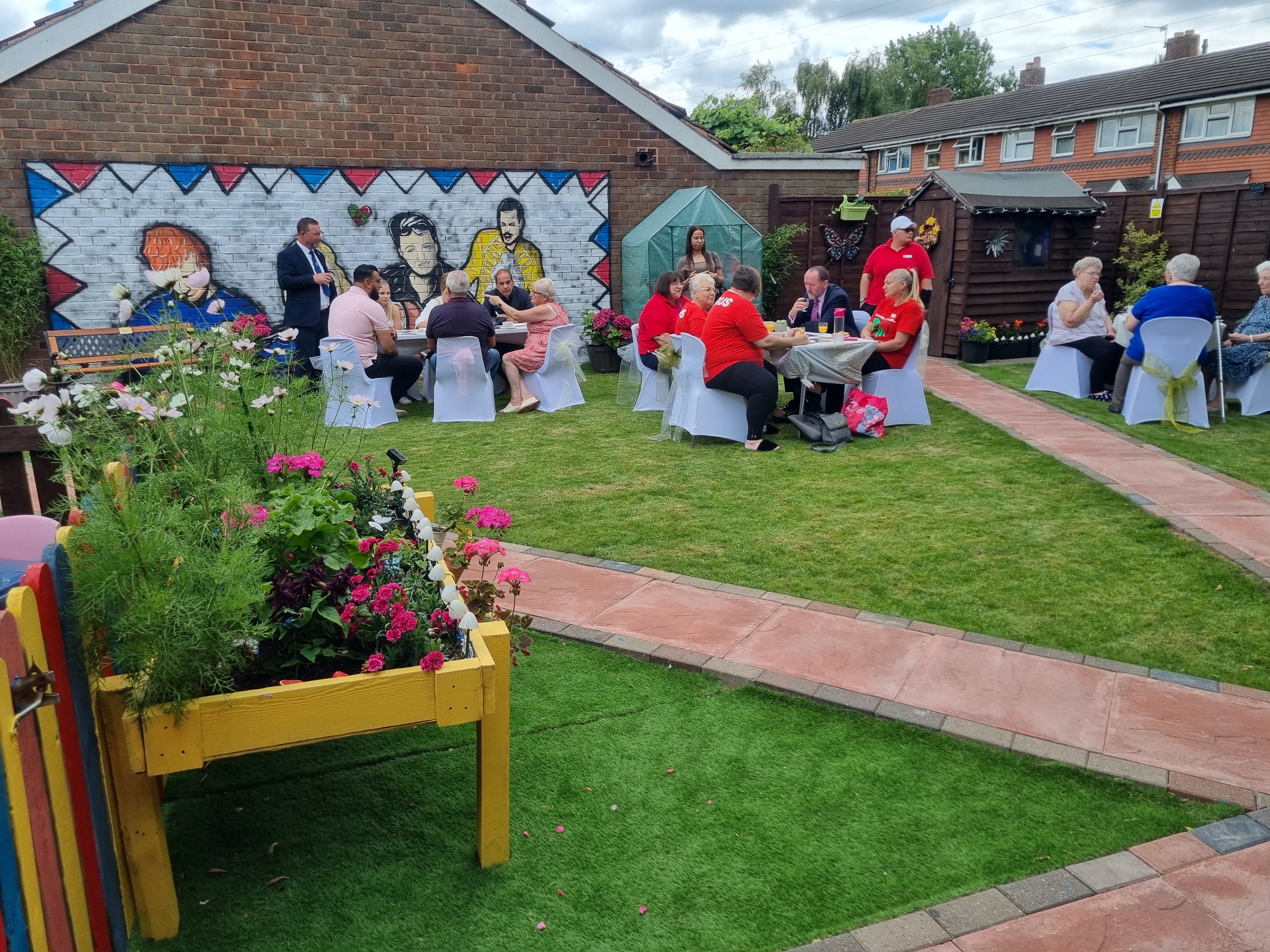 people celebrating the community garden