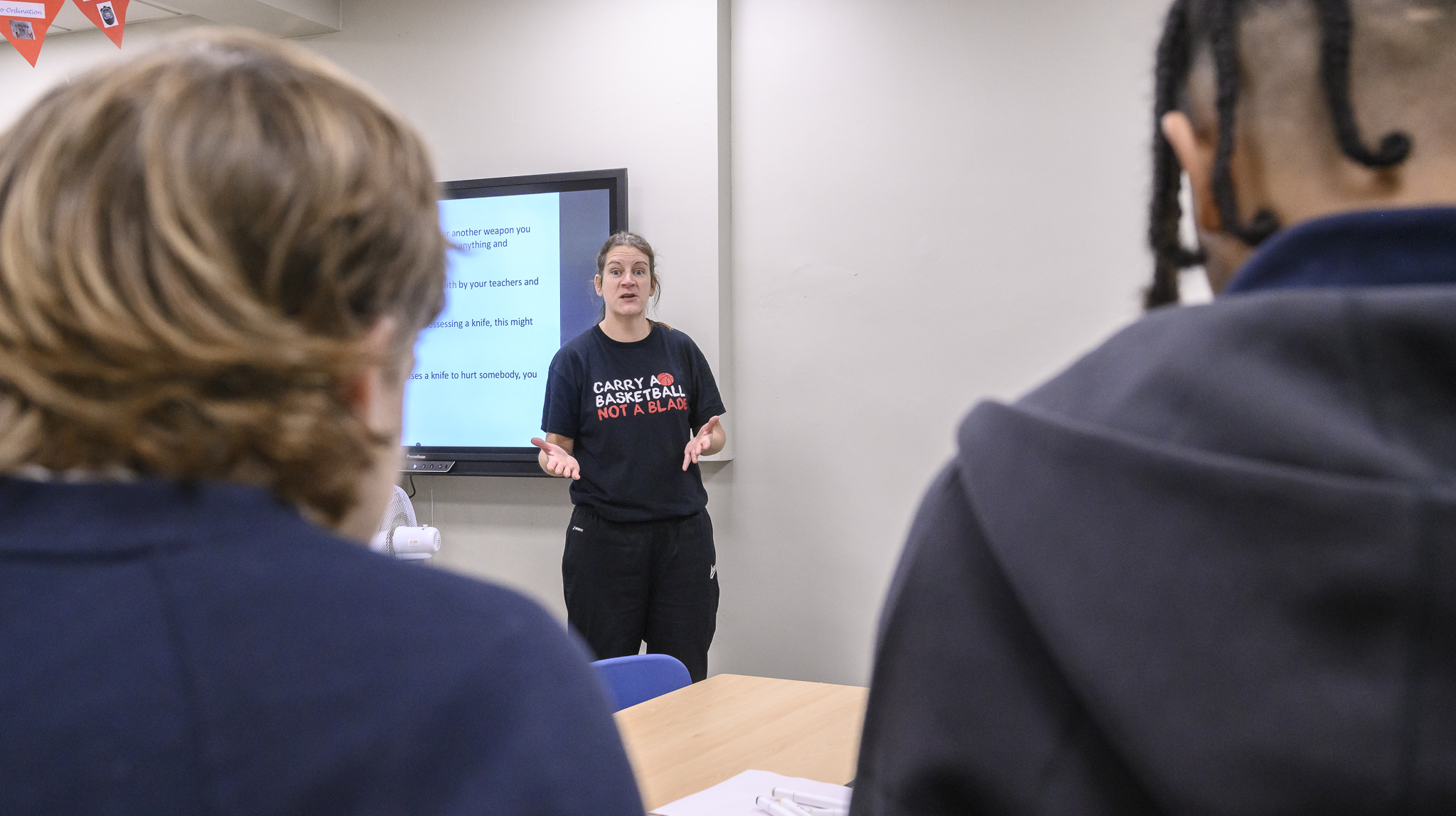 Lady talking to a group of people