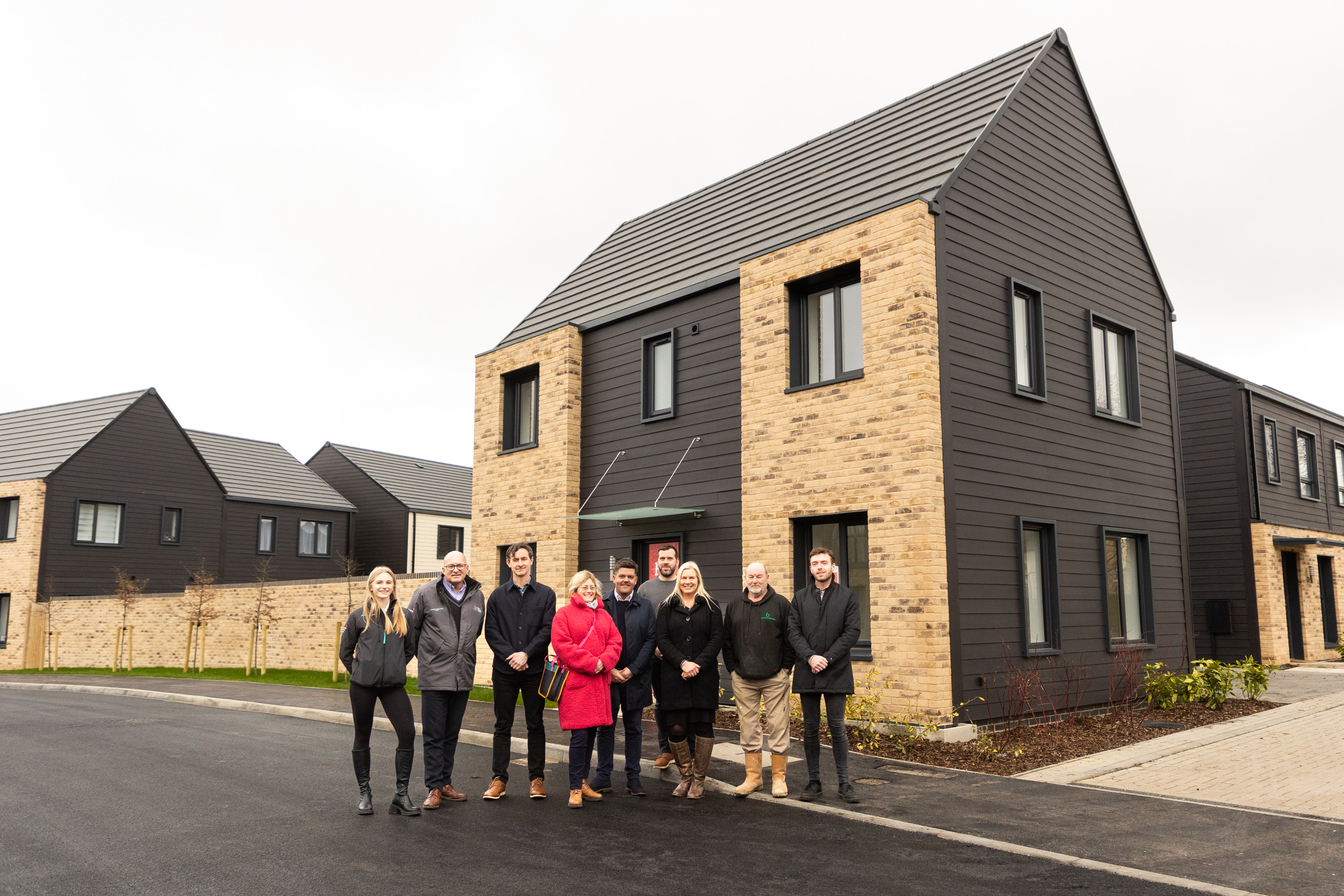 Group of people outside new home