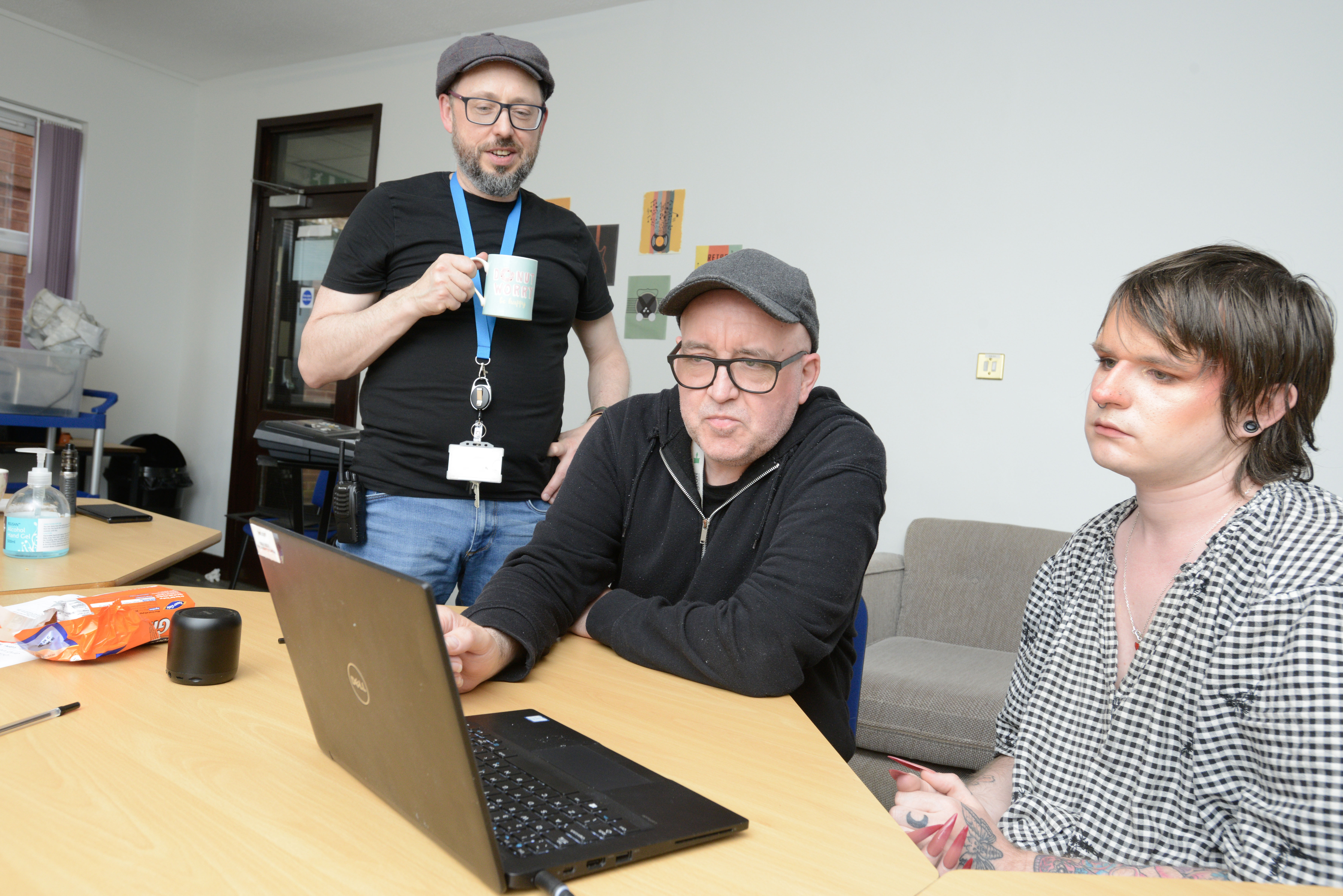 Three people on a laptop