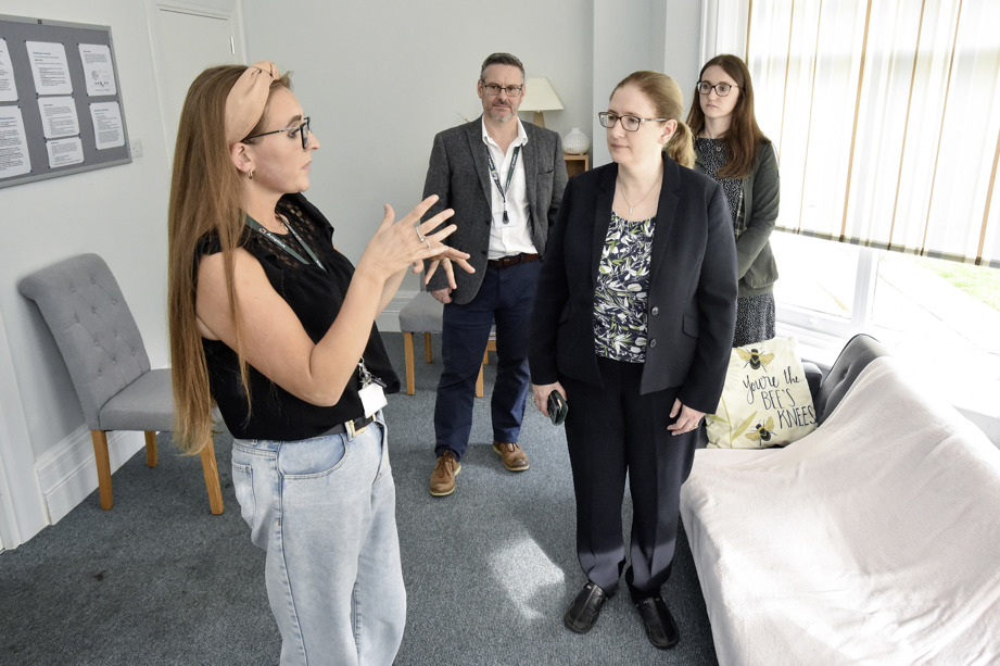 Lady talking to group of people